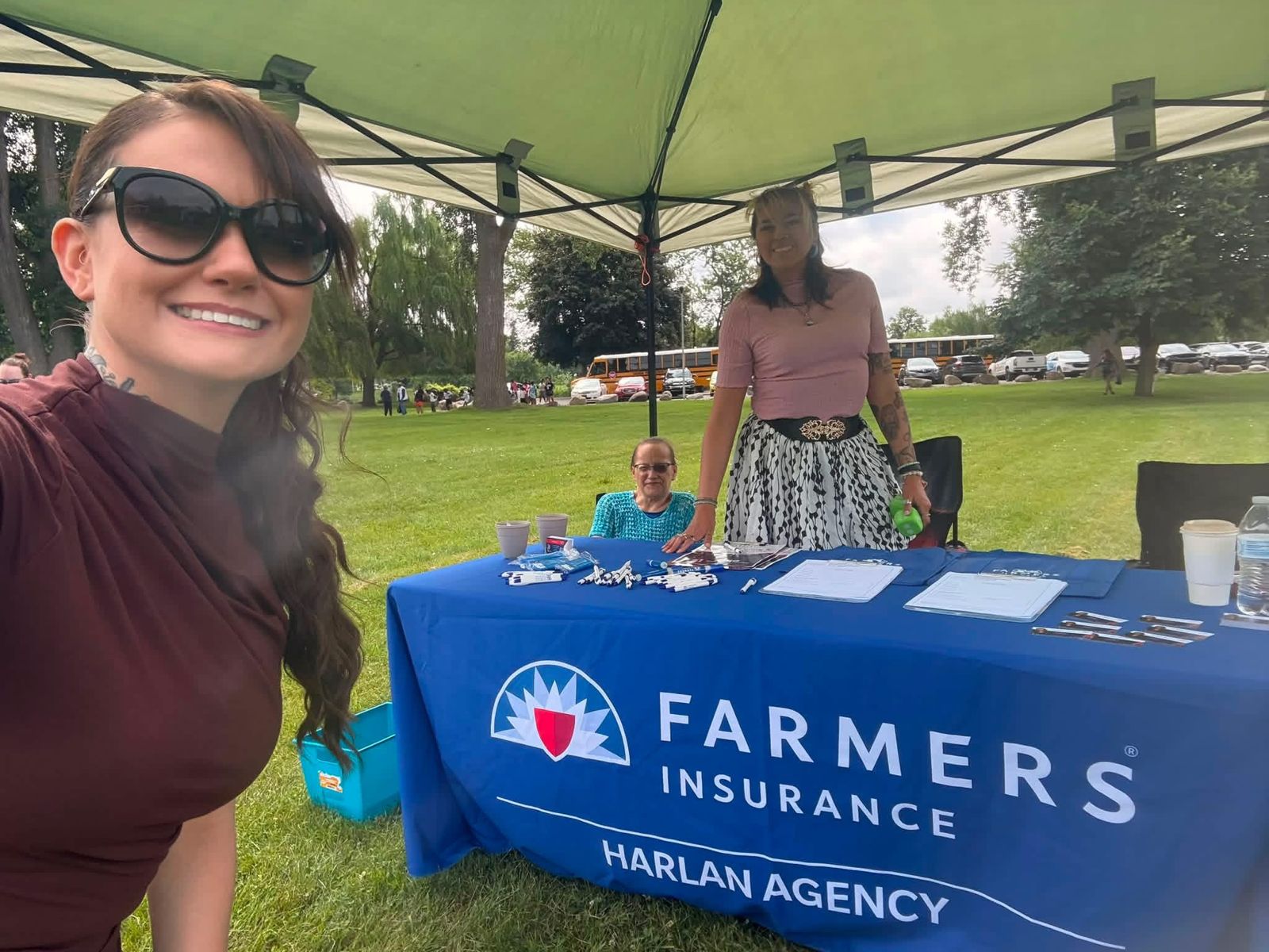 Harlan Agency Farmers Insurance team at a Saginaw community event booth