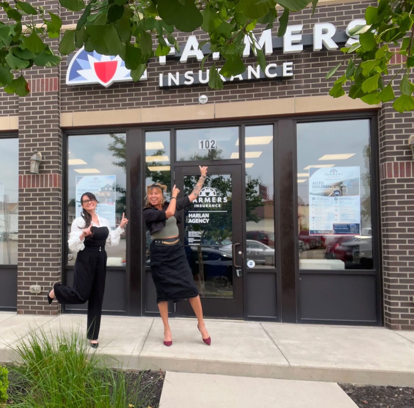 Harlan Agency team outside the Farmers Insurance storefront, Suite 102, N Hamilton St, Saginaw, MI