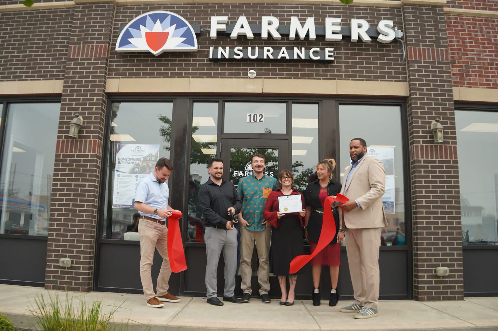 Harlan Insurance Agency ribbon cutting at the Farmers Insurance office on N Hamilton St in Old Town Saginaw, MI